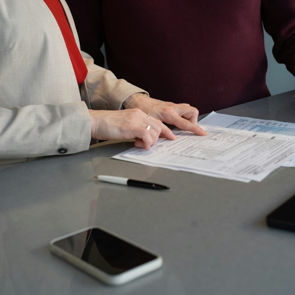 Reviewing mortgage paperwork across a desk
